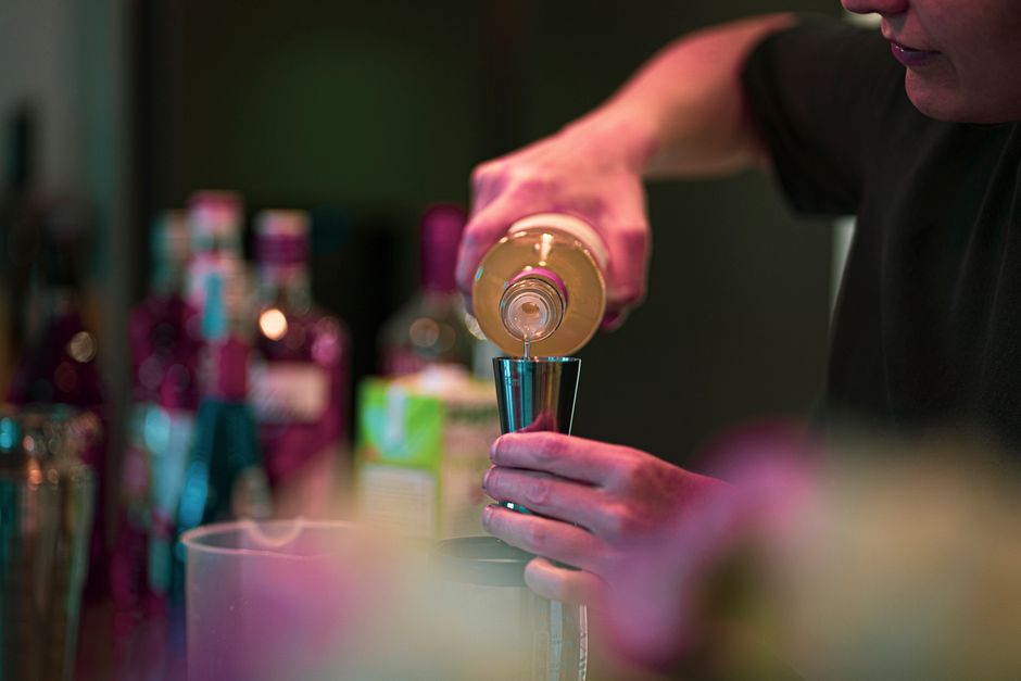 Bartender preparing craft cocktails for a corporate event